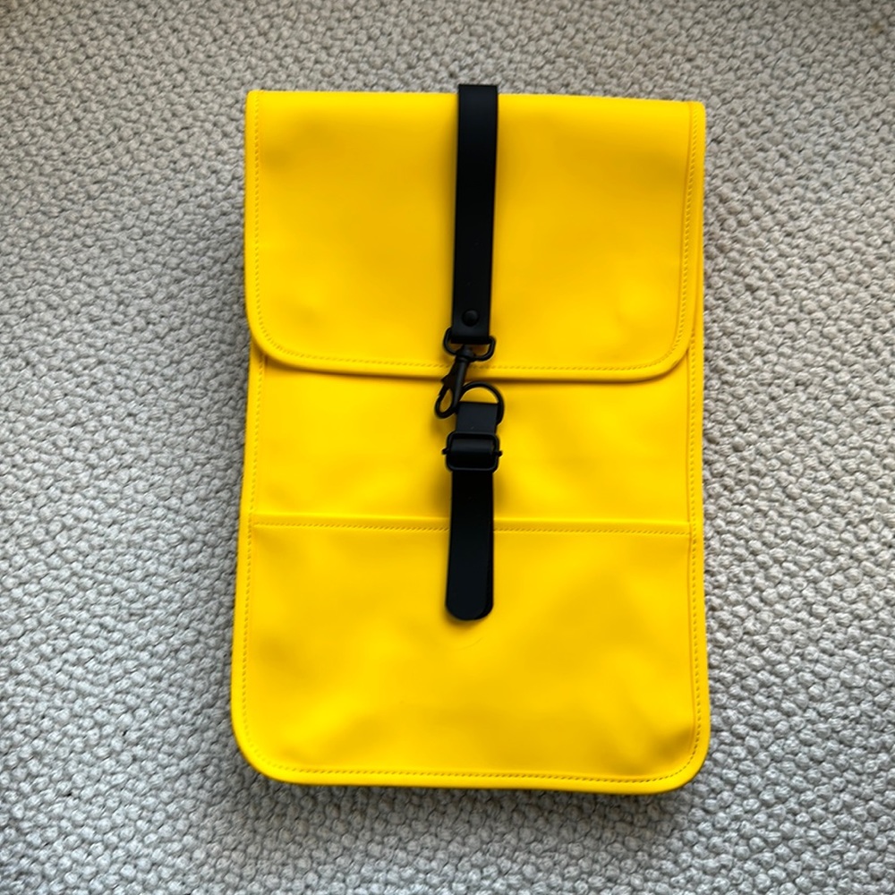 Rains backpack. Yellow